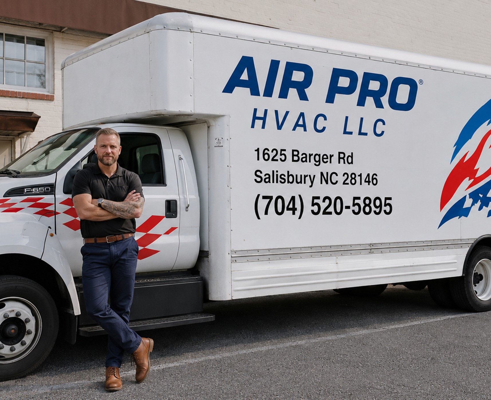 AIR PRO HVAC LLC owner beside branded service truck